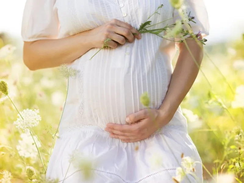 Woman holding her pregnancy bump