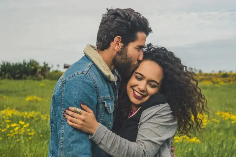 Couple hugging and smiling