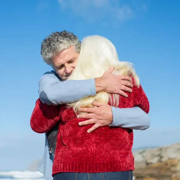 Older couple hugging each other